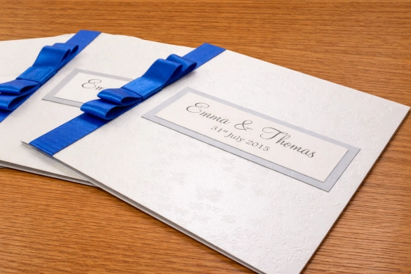 Affordable Flat Layered Ribbon Classic Butterfly Embossed Simple Elegant Classic Fold Wedding Invitation Colours - Diamond Butterfly Embossed (White) Silver Royal Blue Ribbon

